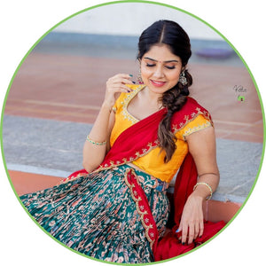 Image features a Patola Lehenga, displaying a vibrant, intricately patterned skirt and blouse, epitomizing traditional Indian style