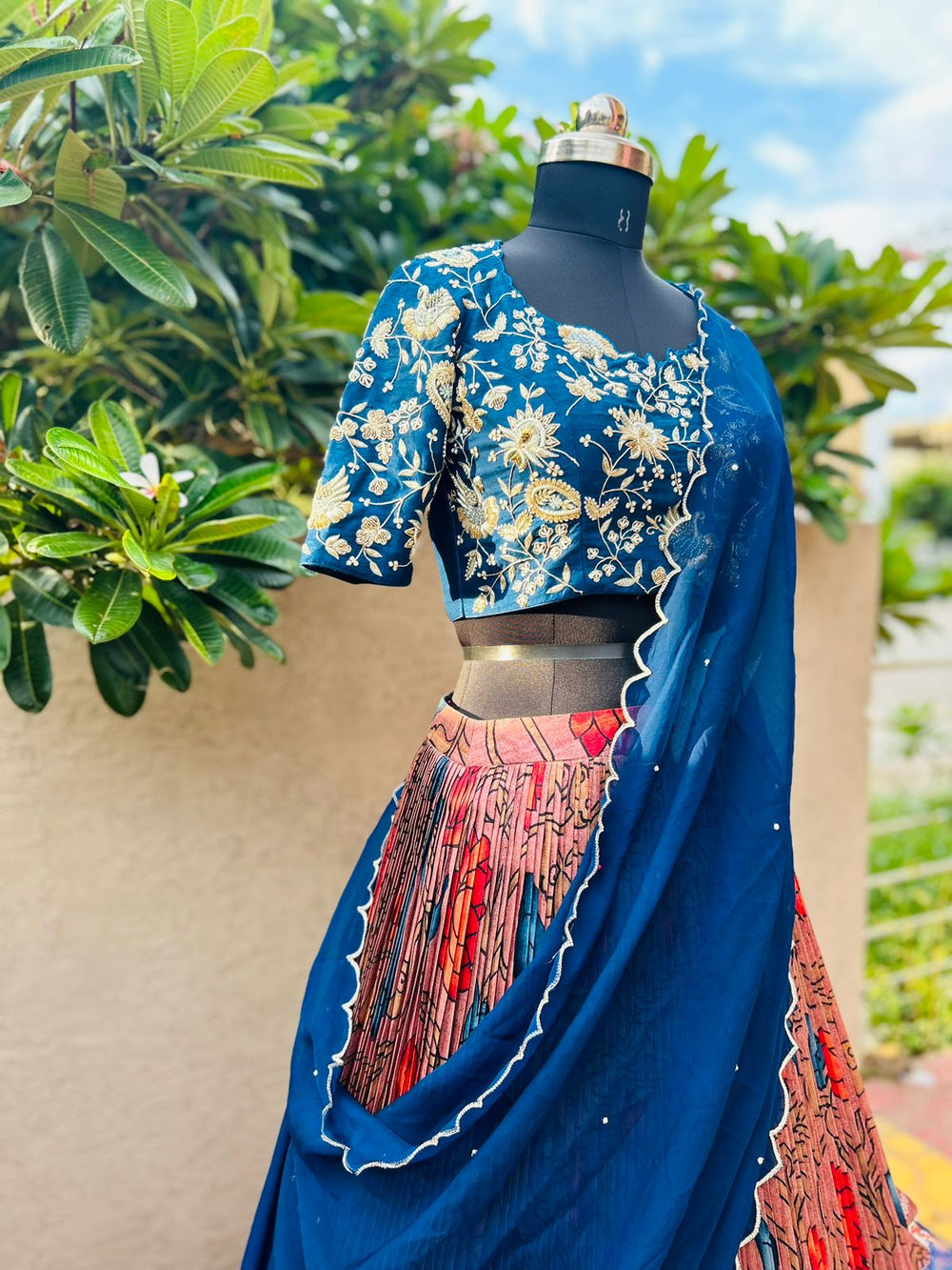 Chic Blue & Peach Kalamkari Silk Lehenga by myRiti, featuring elegant traditional patterns, ideal for fashionable ethnic wear.