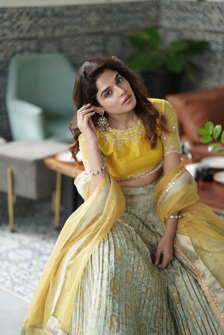 Vibrant Yellow & Pista Bandhani Lehenga from MyRiti, showcasing the traditional art of Bandhani. Ideal for those searching for unique online lehengas, this piece blends cultural heritage with modern elegance.