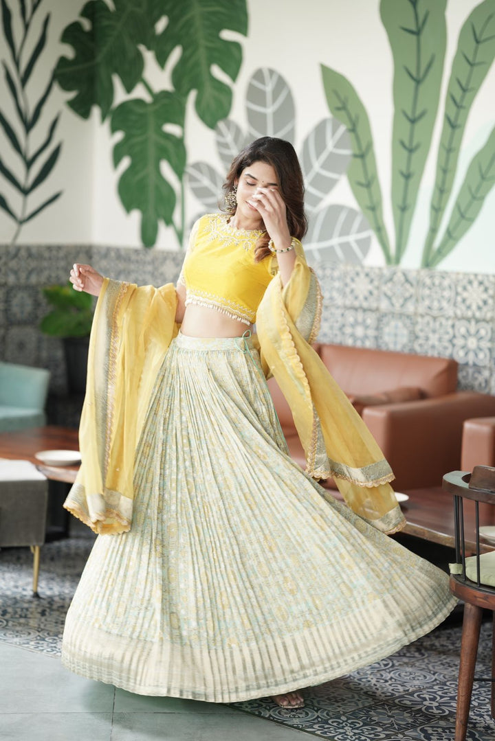 Vibrant Yellow & Pista Bandhani Lehenga from MyRiti, showcasing the traditional art of Bandhani. Ideal for those searching for unique online lehengas, this piece blends cultural heritage with modern elegance.