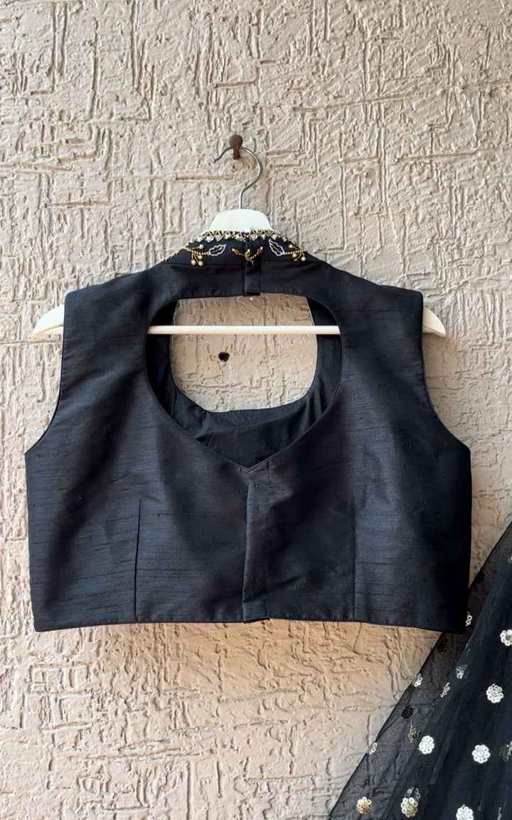 Elegant Handworked Black Lehenga from MyRiti, featuring exquisite artisanal embroidery. Ideal for those seeking sophisticated and unique Indian wear online.