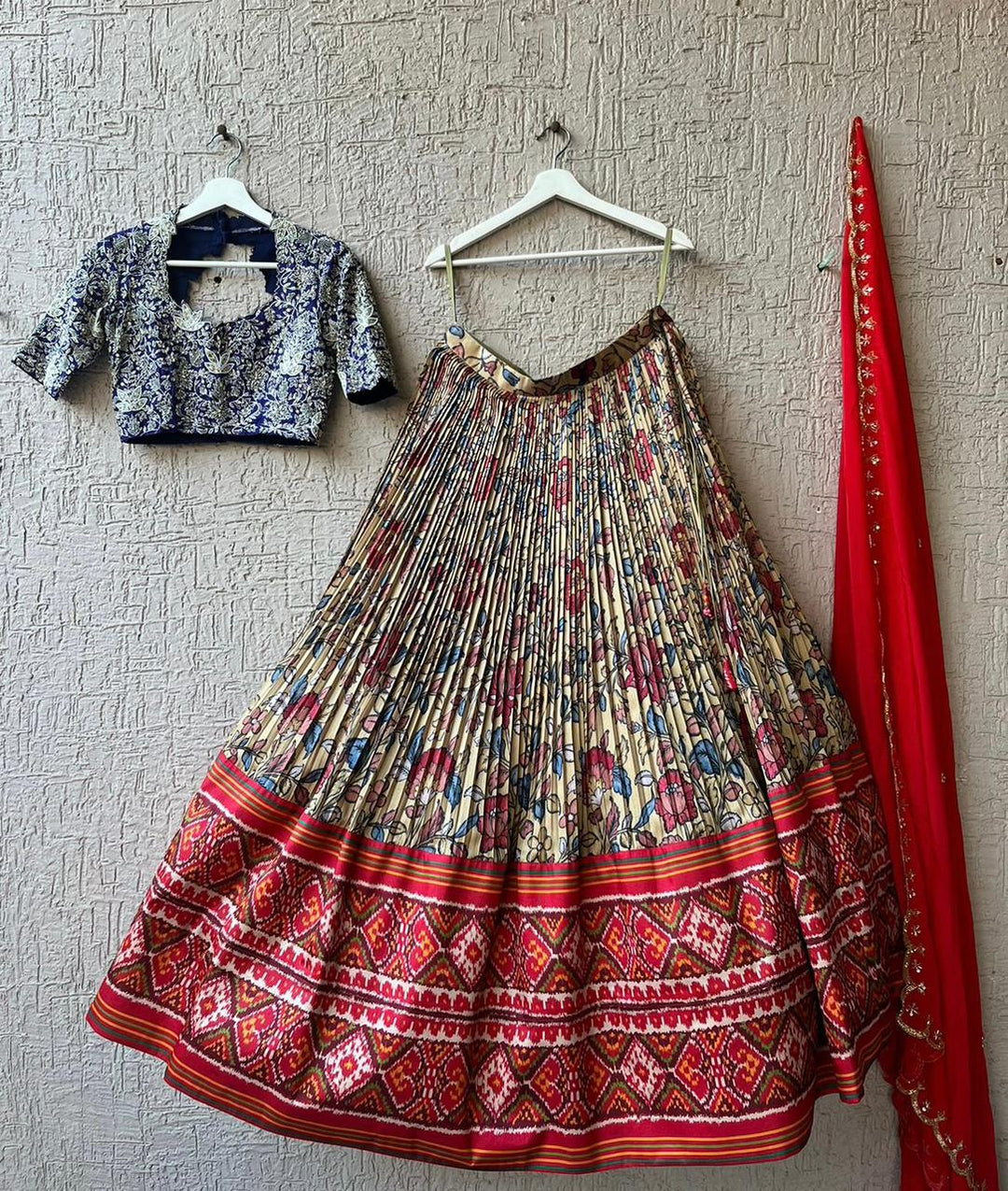 Eye-catching Blue and Red Kalamkari Silk Lehenga, showcasing traditional hand-painted designs, perfect for women seeking a unique and cultural party wear look.