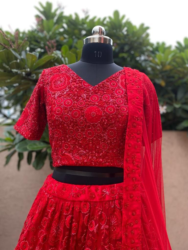 Stunning Bridal Red Net Lehenga, perfect for brides looking for a traditional yet modern wedding dress.