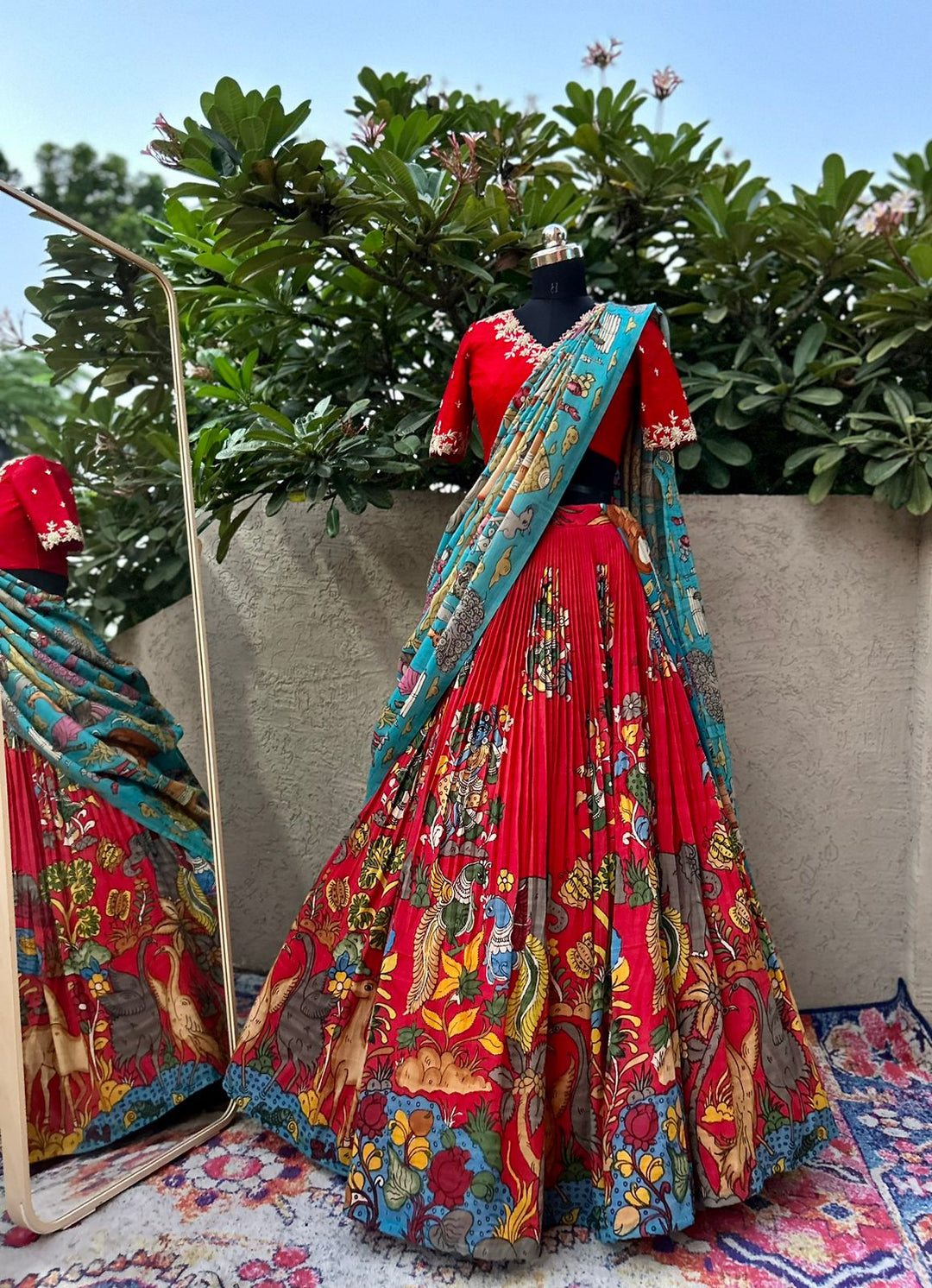 Stunning Red Kalamkari Silk Lehenga by myRiti, featuring intricate traditional designs on rich silk fabric, perfect for festive and bridal wear