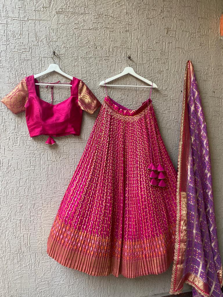 Pink Bandani Lehenga displayed, featuring soft pink color balanced with traditional Bandani designs, perfect for festive occasions.