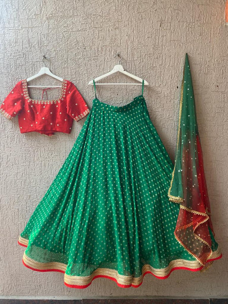 Exquisite Red and Green Georgette Lehenga from MyRiti, a perfect choice for those seeking elegant online lehengas. This vibrant ensemble combines traditional charm with contemporary style.