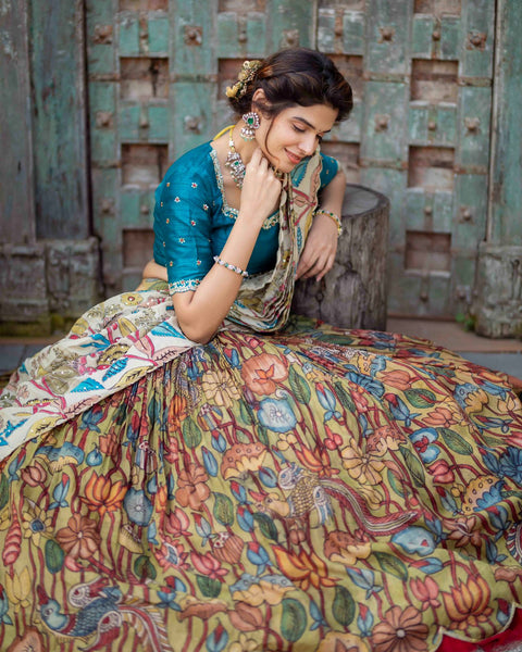 Captivating Peacock Blue Kalamkari Silk Lehenga by myRiti, featuring intricate traditional designs, perfect for exclusive events and celebrations