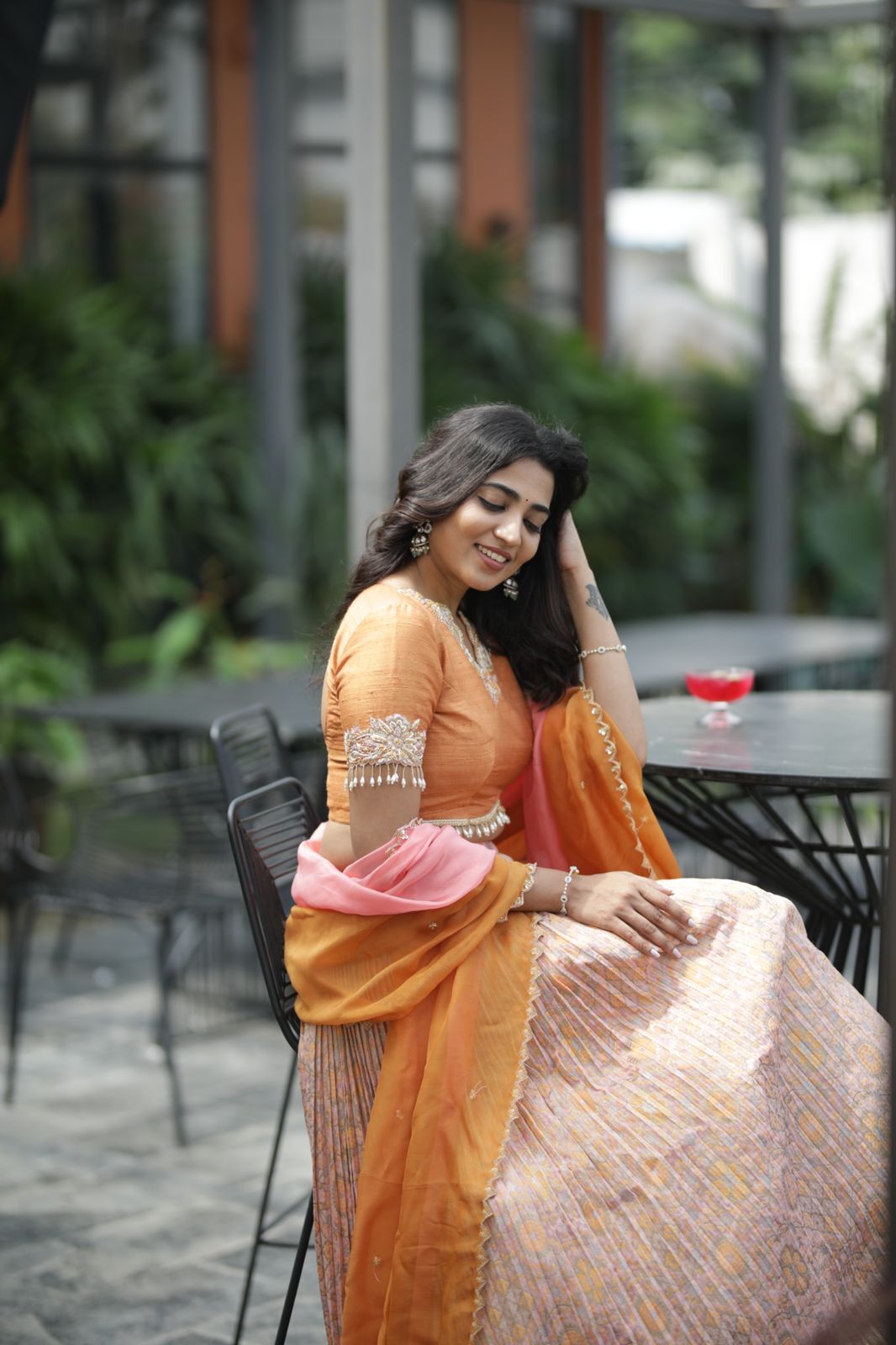 Photograph of Peachish Orange Bandani Lehenga from myRiti, showcasing subtle peachish orange hue with delicate Bandani artwork