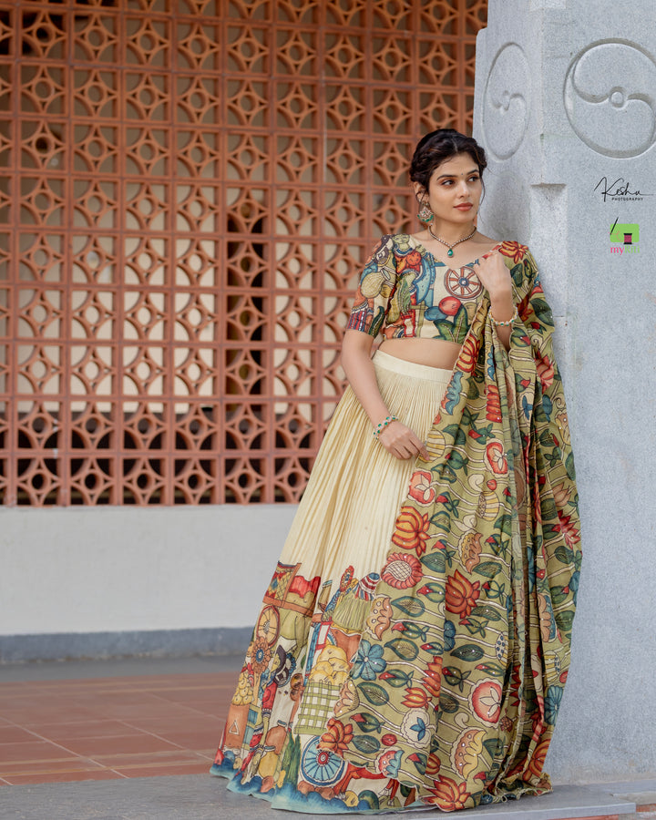 Elegant Cream Kalamkari Lehenga featuring traditional hand-painted designs, available at www.myriti.com. Perfect blend of classic art and modern fashion.