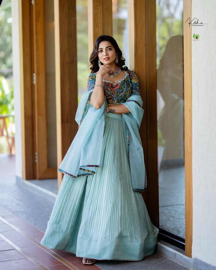 Elegant Powder Blue Tissue Lehenga from myRiti.com, featuring delicate embroidery on lightweight fabric, perfect for a sophisticated and modern look at any special event