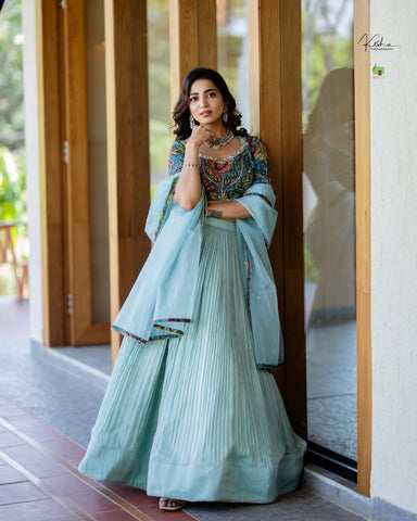 Elegant Powder Blue Tissue Lehenga from myRiti.com, featuring delicate embroidery on lightweight fabric, perfect for a sophisticated and modern look at any special event