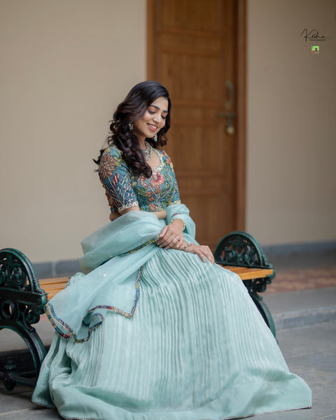 Elegant Powder Blue Tissue Lehenga from myRiti.com, featuring delicate embroidery on lightweight fabric, perfect for a sophisticated and modern look at any special event