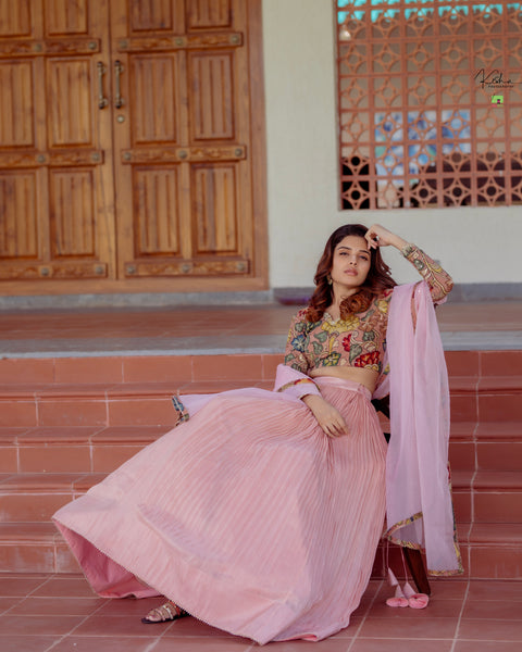 Elegant Pink Tissue Lehenga from MyRiti, showcasing a delicate and luxurious design. Perfect for special occasions, this Pink Lehenga combines traditional elegance with a modern touch.