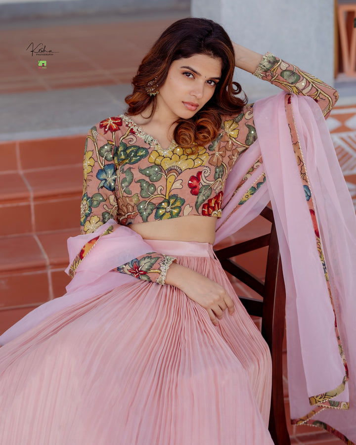 Elegant Pink Tissue Lehenga from MyRiti, showcasing a delicate and luxurious design. Perfect for special occasions, this Pink Lehenga combines traditional elegance with a modern touch.