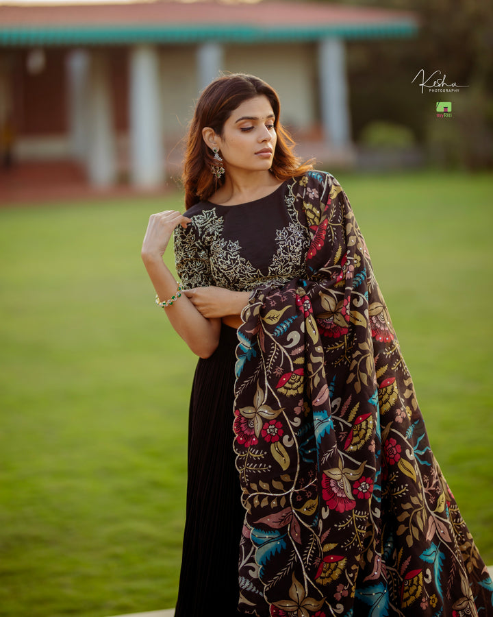 Elegant Black Lehenga in Natural Crape from myRiti.com, paired with a traditional Kalamkari Dupatta, showcasing a unique blend of contemporary style and classic artistry, perfect for ethnic fashion enthusiasts.