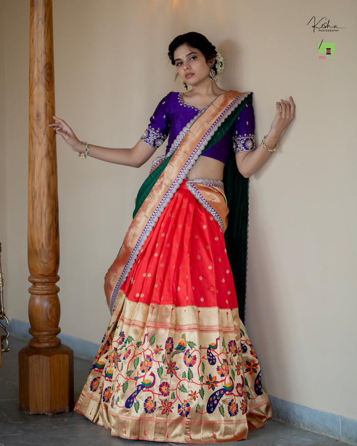 Radiant Red Paithani Lehenga, adorned with exquisite patterns, available at www.myriti.com. A perfect blend of traditional elegance and modern style, ideal for those who love the timeless beauty of Paithani Lehengas.