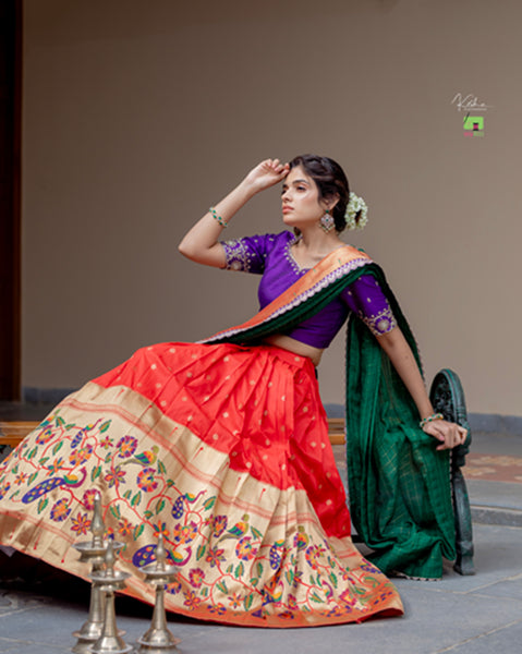 Radiant Red Paithani Lehenga, adorned with exquisite patterns, available at www.myriti.com. A perfect blend of traditional elegance and modern style, ideal for those who love the timeless beauty of Paithani Lehengas.