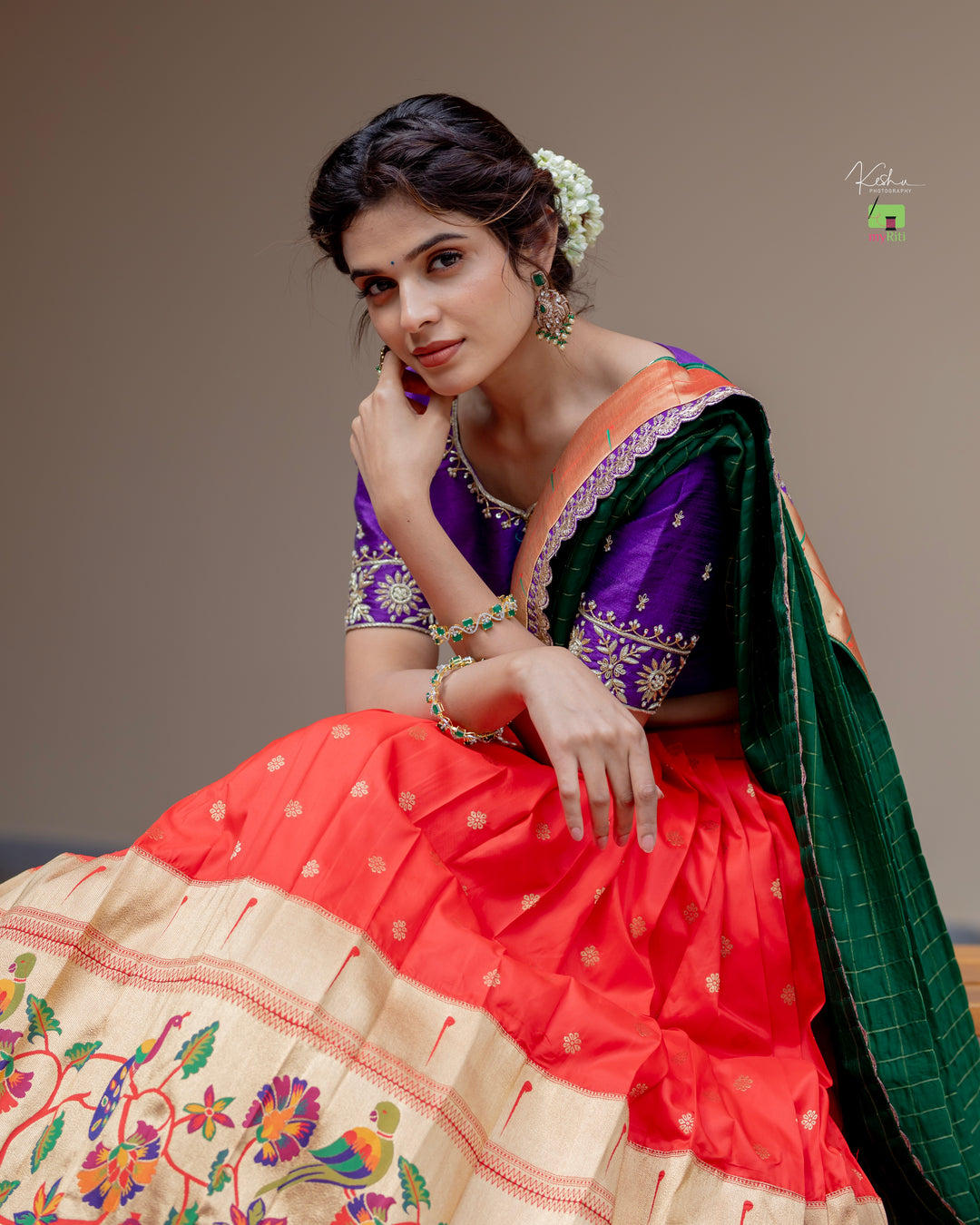 Radiant Red Paithani Lehenga, adorned with exquisite patterns, available at www.myriti.com. A perfect blend of traditional elegance and modern style, ideal for those who love the timeless beauty of Paithani Lehengas.