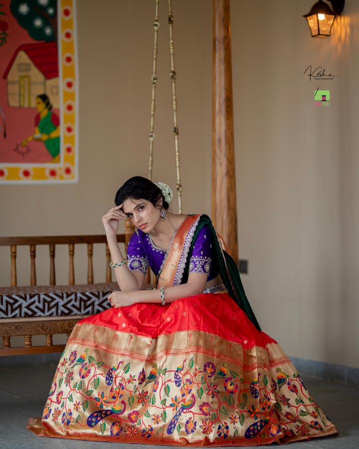 Radiant Red Paithani Lehenga, adorned with exquisite patterns, available at www.myriti.com. A perfect blend of traditional elegance and modern style, ideal for those who love the timeless beauty of Paithani Lehengas.