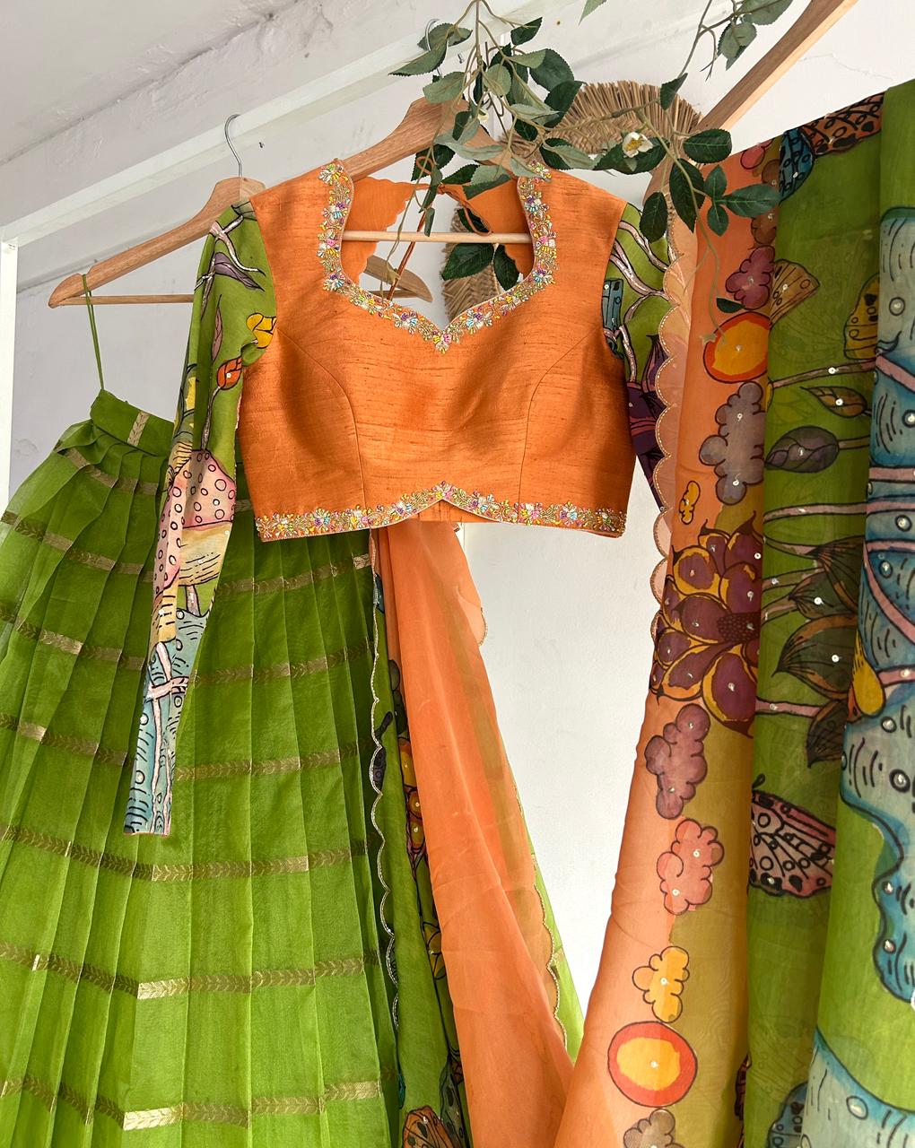 Green & PeachishOrange Organza Kalamkari Lehenga