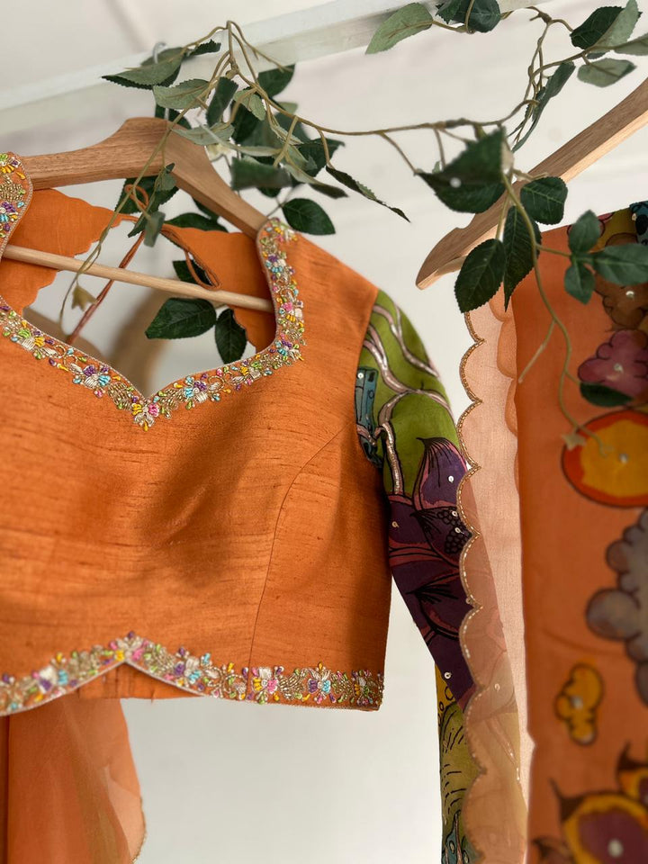 Green & PeachishOrange Organza Kalamkari Lehenga