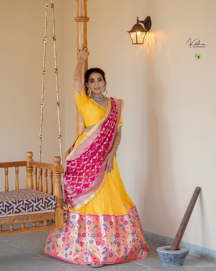 Vibrant Yellow Paithani Lehenga paired with a contrasting Blue Dupatta, showcasing exquisite craftsmanship, available at MyRiti. Ideal for adding a touch of traditional elegance to any special occasion.