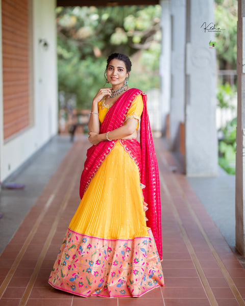 Vibrant Yellow Paithani Lehenga paired with a contrasting Blue Dupatta, showcasing exquisite craftsmanship, available at MyRiti. Ideal for adding a touch of traditional elegance to any special occasion.