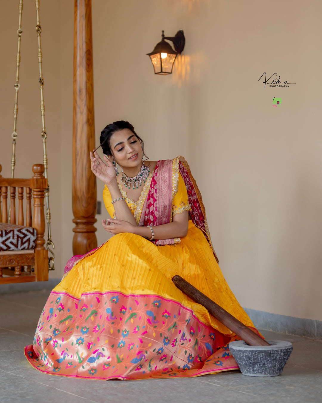 Vibrant Yellow Paithani Lehenga paired with a contrasting Blue Dupatta, showcasing exquisite craftsmanship, available at MyRiti. Ideal for adding a touch of traditional elegance to any special occasion.