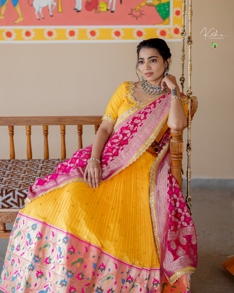 Vibrant Yellow Paithani Lehenga paired with a contrasting Blue Dupatta, showcasing exquisite craftsmanship, available at MyRiti. Ideal for adding a touch of traditional elegance to any special occasion.